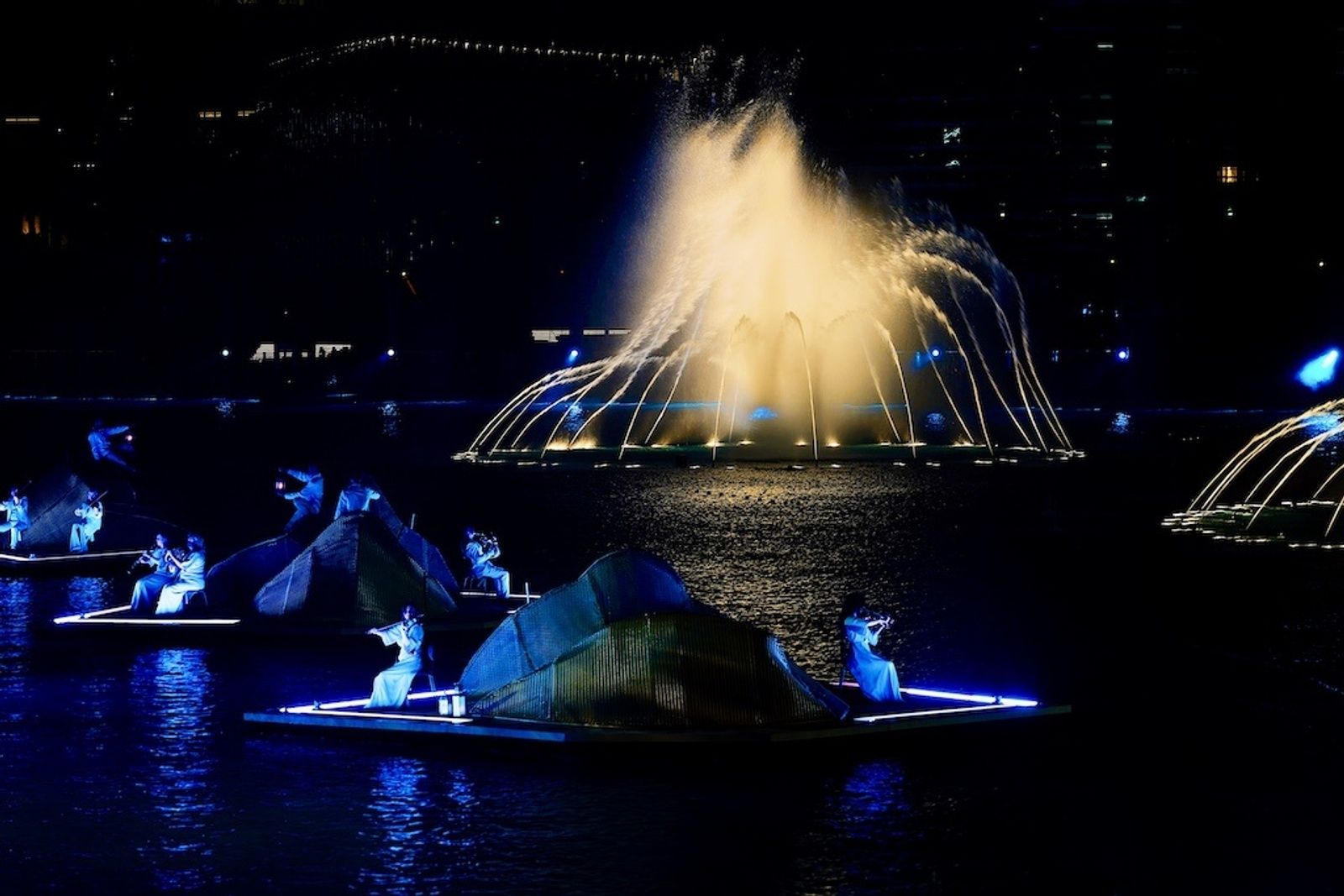 An orchestra performs on the lake during EMAAR's New Year's Eve spectacular in Dubai