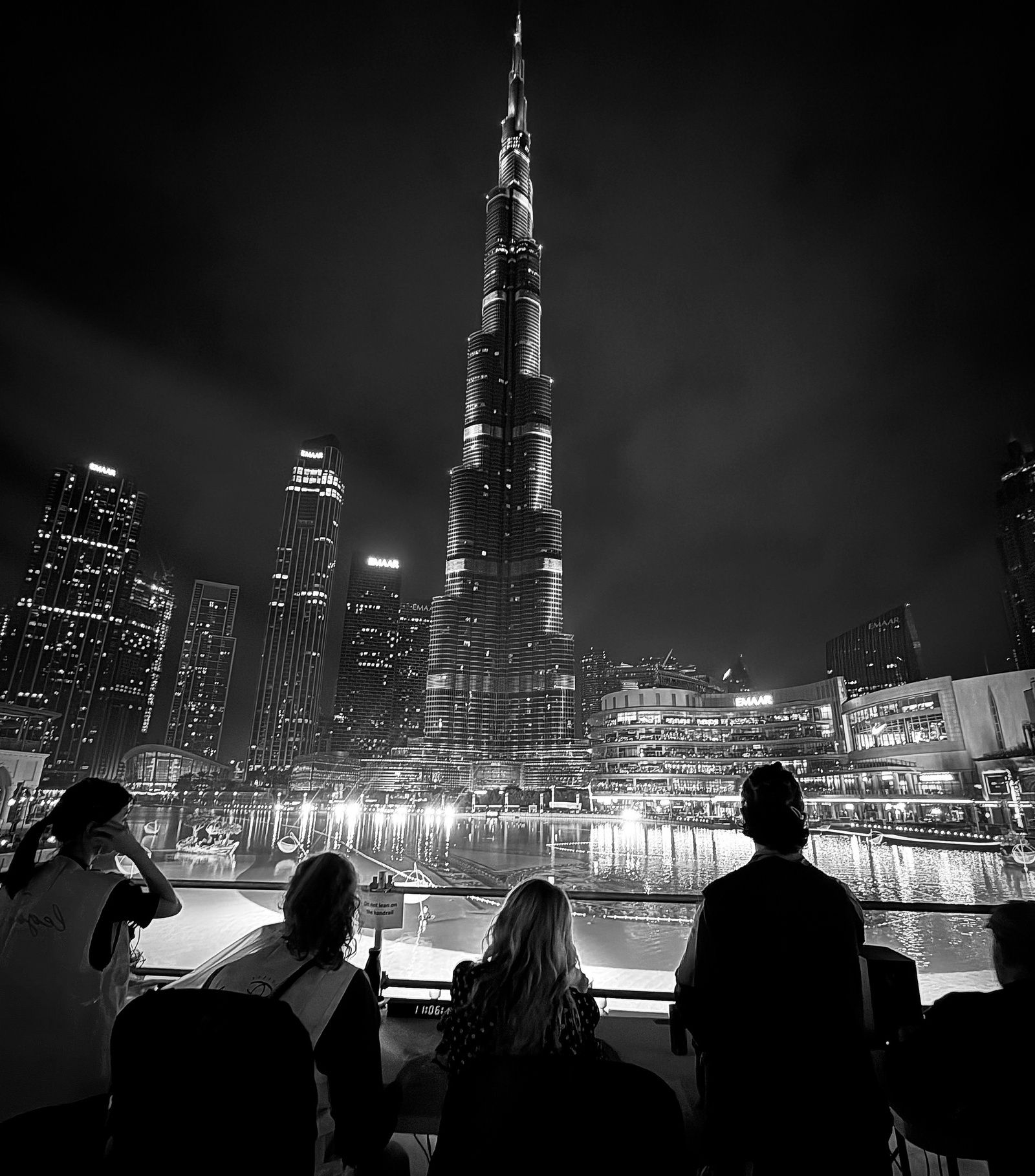 Crowds watch the Burj Khalifa light up during Dubai's New Year's Eve celebration